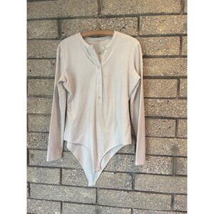 Reformation Soft Henley Long Sleeve Bodysuit In Whispered Neutrals